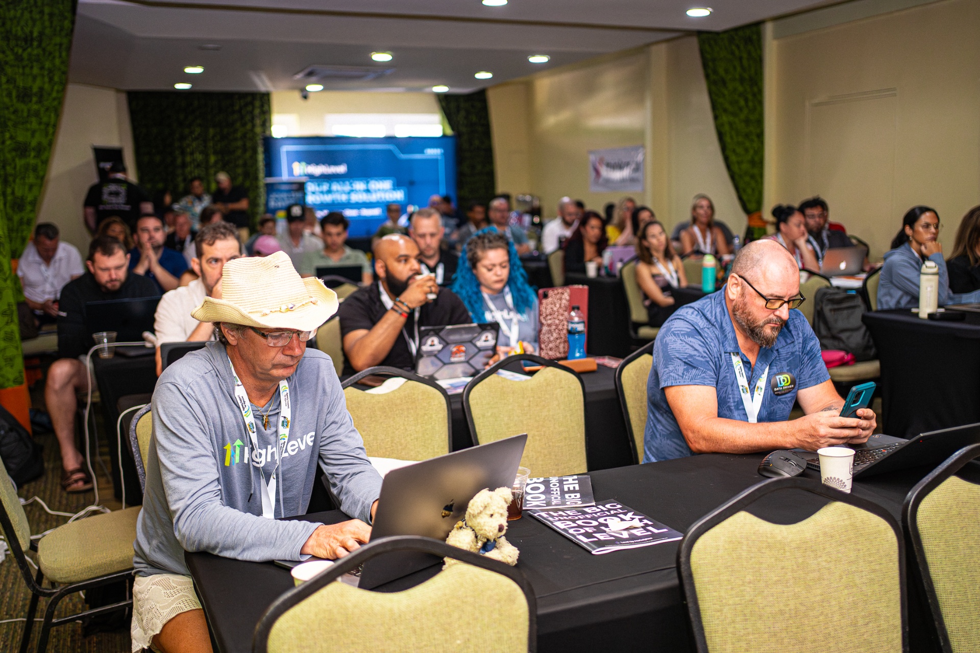 Laptops open, room fully engaged